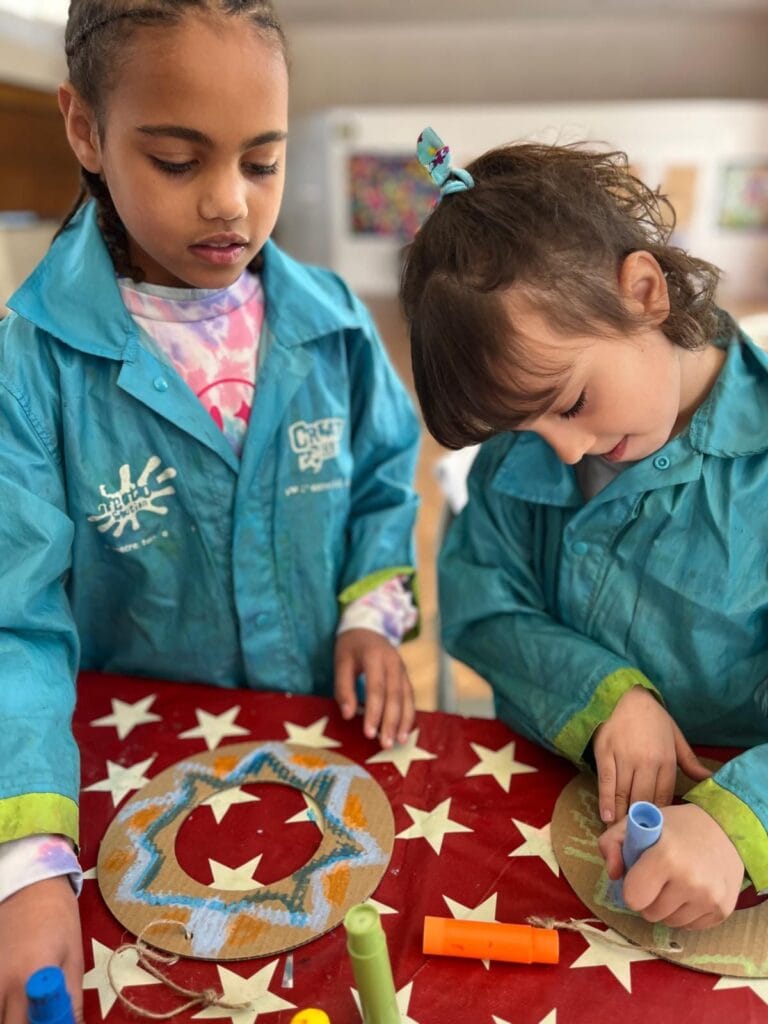 Group of children collaborating on a themed art project