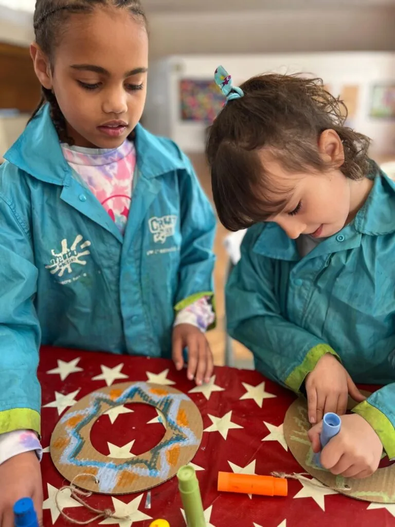 Group of children collaborating on a themed art project