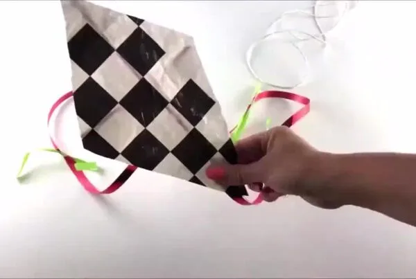 Close-up of a colourful eco-friendly kite created using plastic bag and string