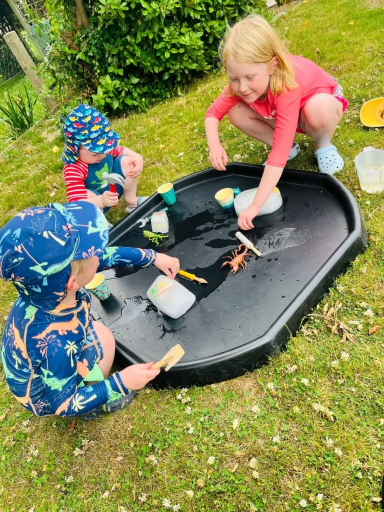 Children rescuing toys from ice – a sensory and scientific way to stay cool while learning through play